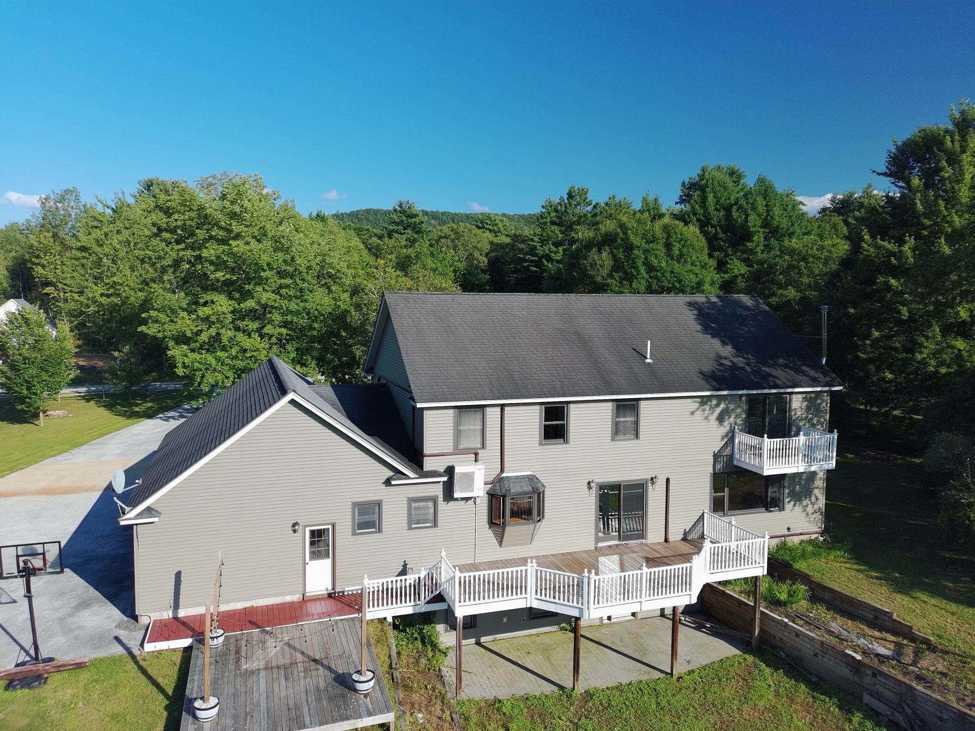 Drone photo capturing a Vermont home's exterior and backyard