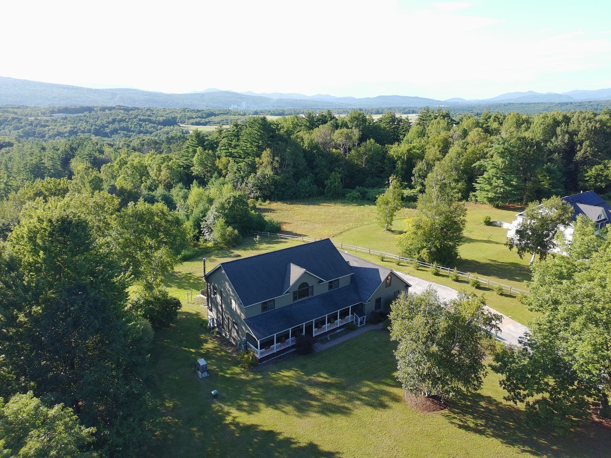 Aerial real estate photo of a Vermont home from a low angle