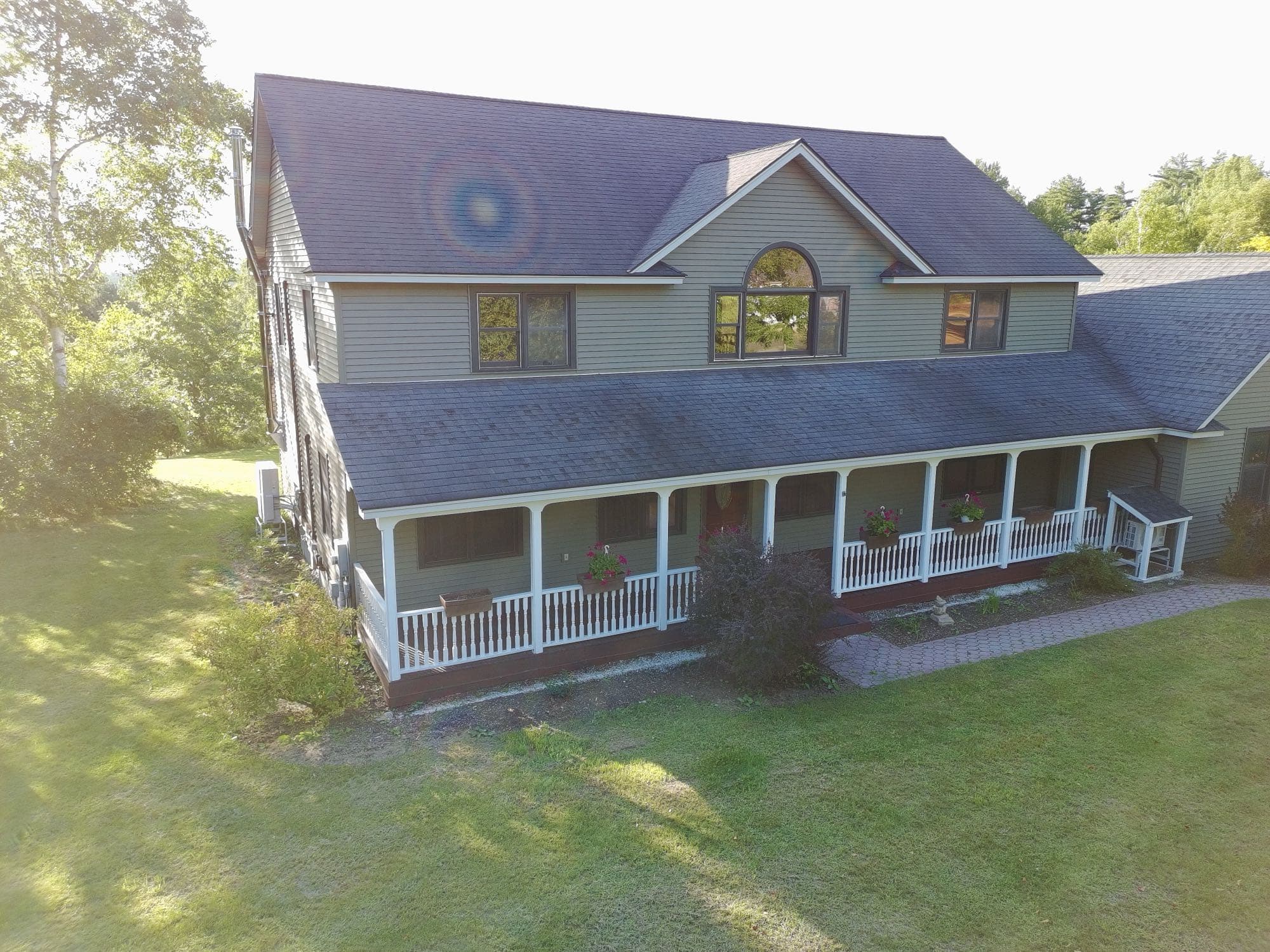 Drone photo of a Rutland County property from above the tree canopy